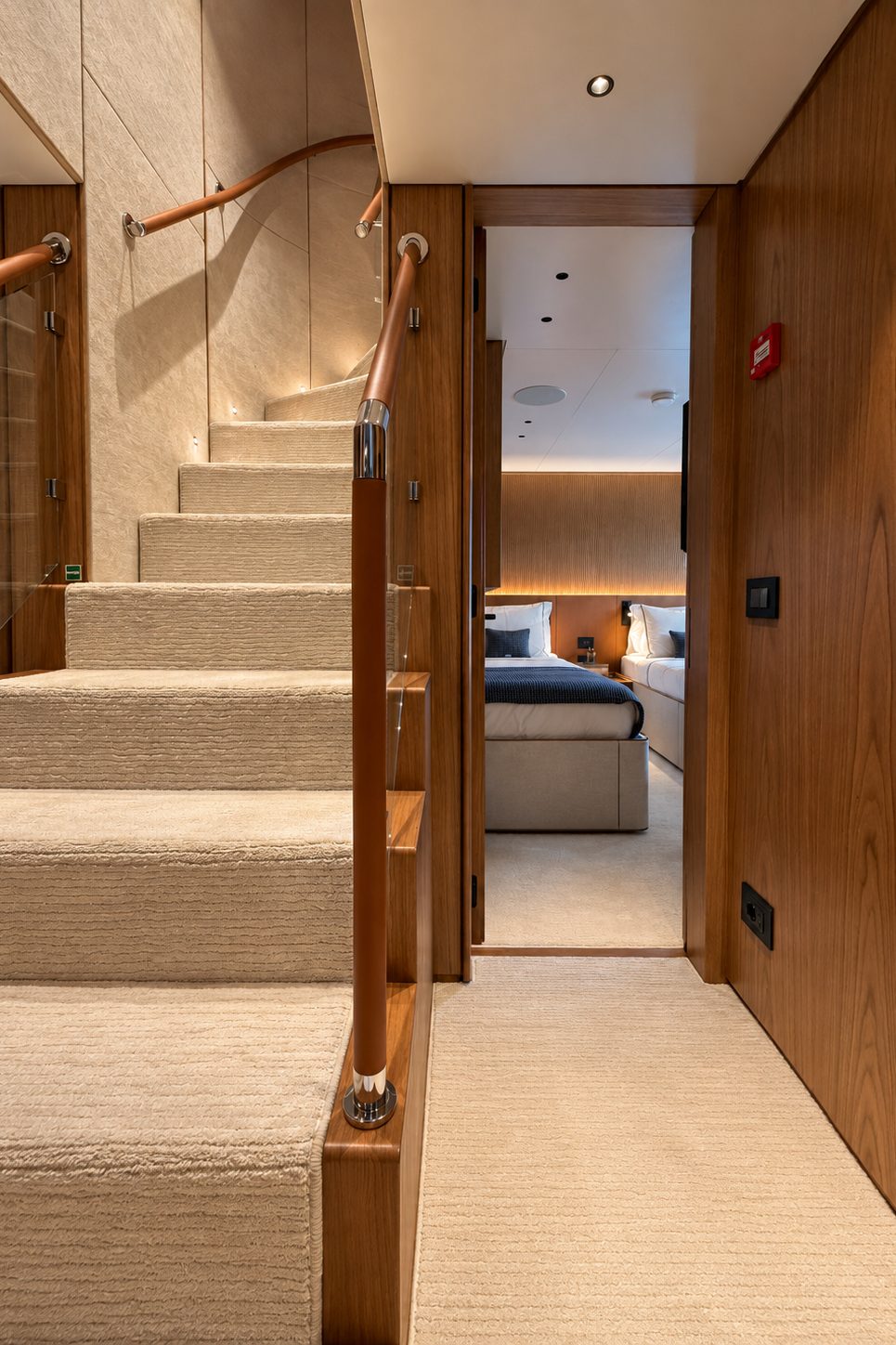 Oak staircase with leather handrail leading down to the lower deck